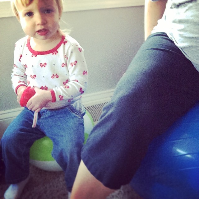 Mommy and daughter bouncing on the labor ball @ohbotherblog